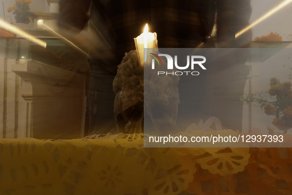 A view of a skull inside a chapel in the Sierra Madre Sur of Mexico, where dozens of people gather for a Day of the Dead procession. They pl... by Gerardo Vieyra/NurPhoto