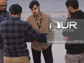 Islamic Revolutionary Guard Corps (IRGC) drone specialists check drone software before participating in a triangular drone flying formation... by Morteza Nikoubazl/NurPhoto