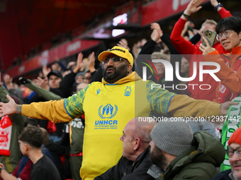 Forest supporters gesticulate towards the Manchester Utd supporters during the Premier League match between Nottingham Forest and Manchester... by MI News/NurPhoto