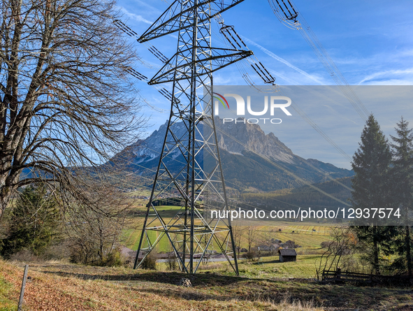 High-voltage electricity pylons and power lines stretch across the valley floor, supplying power and energy to the region in Lermoos, Tyrol,... by Michael Nguyen/NurPhoto