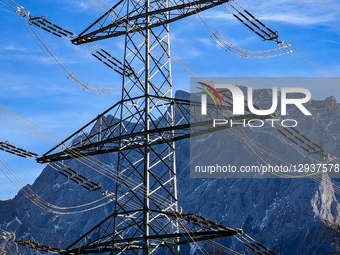 High-voltage electricity pylons and power lines stretch across the valley floor, supplying power and energy to the region in Lermoos, Tyrol,... by Michael Nguyen/NurPhoto