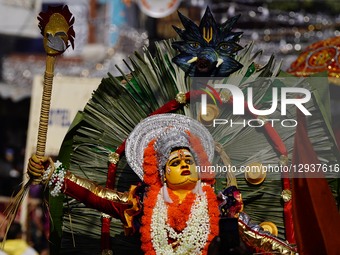 An Indian artist dresses as the Hindu deity Bhagawathy and performs during the Spiritual Walk procession in Pushkar, Rajasthan, India, on No... by Himanshu Sharma/NurPhoto