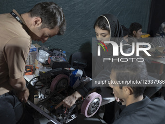 Young Iranian robotics specialists prepare their robot to participate in the Robot Warriors competition, held during Iran's 2025 Tech Olympi... by Morteza Nikoubazl/NurPhoto