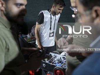 Young Iranian robotics specialists prepare their robot to participate in the Robot Warriors competition, held during Iran's 2025 Tech Olympi... by Morteza Nikoubazl/NurPhoto