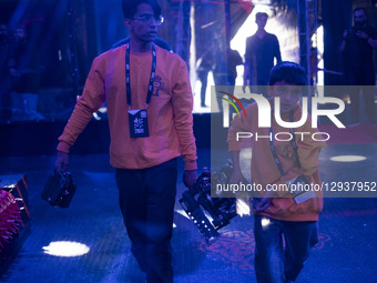 Two Iranian robotics specialists carry their robot to participate in the Robot Warriors competition, held during Iran's 2025 Tech Olympics a... by Morteza Nikoubazl/NurPhoto