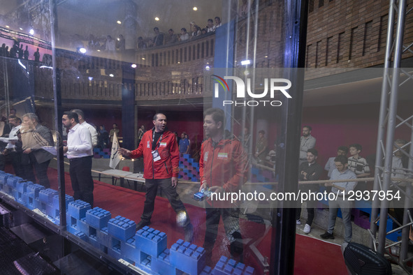 An Iranian robotics specialist controls his robot while participating in the Robot Warriors competition during Iran's 2025 Tech Olympics at... by Morteza Nikoubazl/NurPhoto