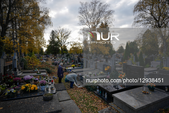 Visitors are seen at the Brodno Cemetery in Warsaw, Poland on 01 November, 2025.  by Jaap Arriens/NurPhoto