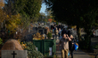 Visitors are seen at the Brodno Cemetery in Warsaw, Poland on 01 November, 2025. 