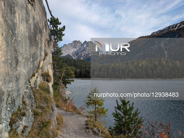 A narrow scenic trail lies above the water of Lake Blindsee near Biberwier, Tyrol, Austria, on November 1, 2025. The popular hiking destinat... by Michael Nguyen/NurPhoto