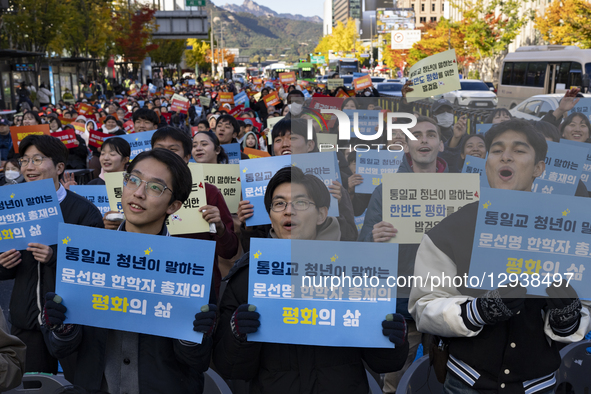 Participants hold placards reading ''Religious freedom is a basic civil right'' and chant slogans during the ''One Mind Peace Rally for Reli... by Chris Jung/NurPhoto