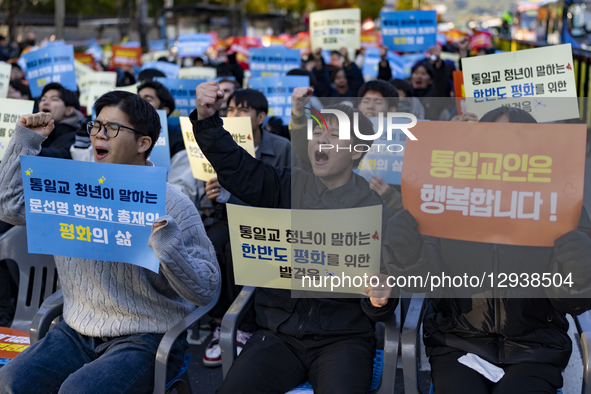 Participants hold placards reading ''Religious freedom is a basic civil right'' and chant slogans during the ''One Mind Peace Rally for Reli... by Chris Jung/NurPhoto