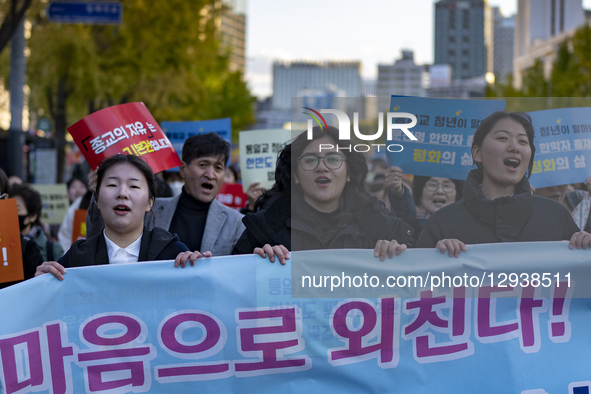 Members and youth of the Family Federation for World Peace and Unification, also known as the Unification Church, march through downtown Seo... by Chris Jung/NurPhoto