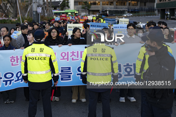 Members and youth of the Family Federation for World Peace and Unification, also known as the Unification Church, march through downtown Seo... by Chris Jung/NurPhoto