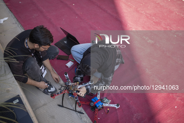 Iranian drone specialists check their drone before participating in a competition during Iran's 2025 Tech Olympics at Pardis Technology Park... by Morteza Nikoubazl/NurPhoto