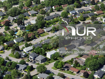 An elevated view shows houses in a neighborhood in Quebec, Canada, on June 22, 2025.  by Creative Touch Imaging Ltd/NurPhoto