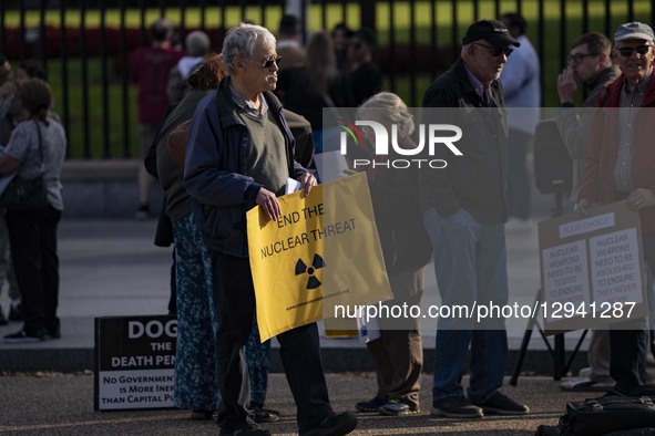 People protest against nuclear weapons outside the White House fence in Washington, DC, on November 2, 2025, as President Donald J. Trump gi... by Andrew Thomas/NurPhoto