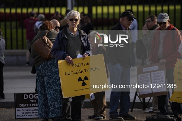 People protest against nuclear weapons outside the White House fence in Washington, DC, on November 2, 2025, as President Donald J. Trump gi... by Andrew Thomas/NurPhoto