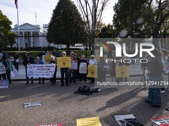 People protest against nuclear weapons outside the White House fence in Washington, DC, on November 2, 2025, as President Donald J. Trump gi... by Andrew Thomas/NurPhoto