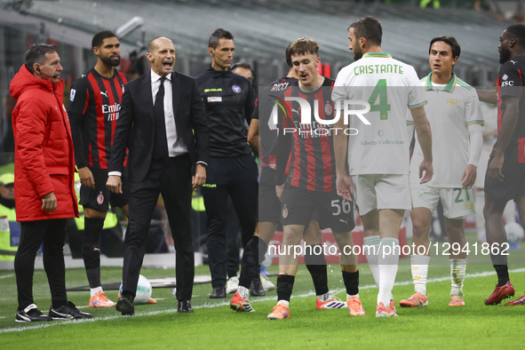 Alexis Saelemaekers and Massimiliano Allegri are in action during the Serie A match between AC Milan and AS Roma at Giuseppe Meazza stadium... by Mairo Cinquetti/NurPhoto