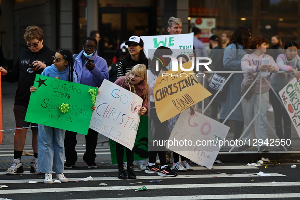 People hold up placards to support friends running in the 2024 New York City Marathon in New York City, United States, on November 2, 2025.  by Gordon Donovan/NurPhoto