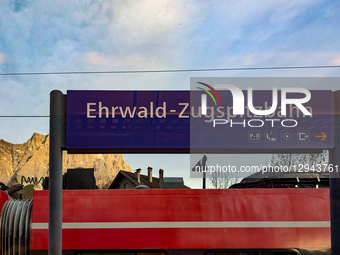 A red DB Regio train is at the Ehrwald Zugspitzbahn station platform in Ehrwald, Tyrol, Austria, on November 1, 2025. The station provides e... by Michael Nguyen/NurPhoto
