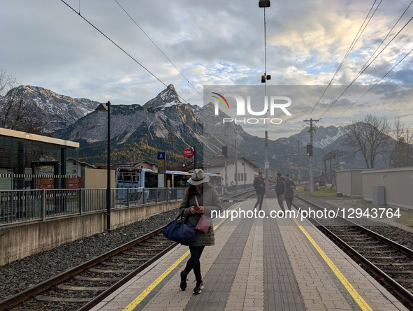 At the Ehrwald Zugspitzbahn station platform, travelers wait for the train to Munich in Ehrwald, Tyrol, Austria, on November 1, 2025. The st... by Michael Nguyen/NurPhoto
