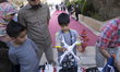 A young Iranian boy looks at a drone after participating in a training session at Pardis T...