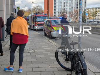 A convoy of emergency vehicles, including fire engines, lines a street with blue flashing lights in Munich, Bavaria, Germany, on November 3,... by Michael Nguyen/NurPhoto