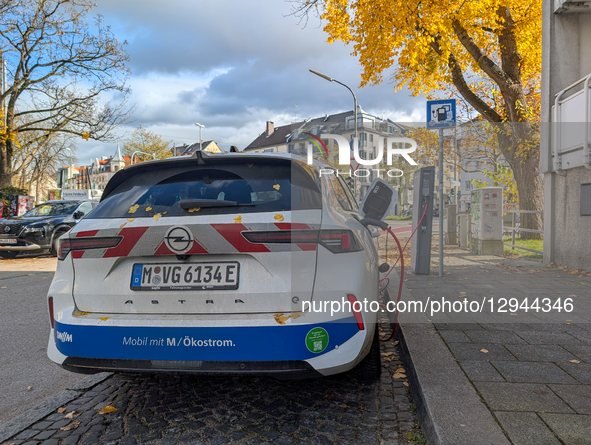An electric vehicle charges at a public charging station in Munich, Bavaria, Germany, on November 3, 2025.  by Michael Nguyen/NurPhoto