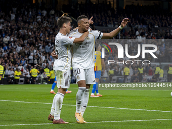 Kylian Mbappe of Real Madrid celebrates his goal with Arda Guler of Real Madrid during the LaLiga EA Sports football match between Real Madr... by Alberto Gardin/NurPhoto