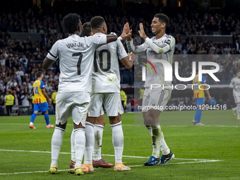 Kylian Mbappe of Real Madrid celebrates his goal with Vinicius Junior and Jude Bellingham of Real Madrid during the LaLiga EA Sports footbal... by Alberto Gardin/NurPhoto