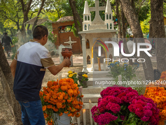 People attend the Municipal Cemetery to keep vigil and decorate the graves of their deceased loved ones on the Day of the Dead in Queretaro,... by Eyepix/NurPhoto