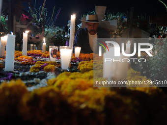 People visit the San Andres Mixquic cemetery, located in Tlahuac, to accompany their deceased loved ones in the traditional lighting ceremon... by Eyepix/NurPhoto