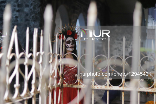 People visit the San Andres Mixquic cemetery, located in Tlahuac, to accompany their deceased loved ones in the traditional lighting ceremon... by Eyepix/NurPhoto