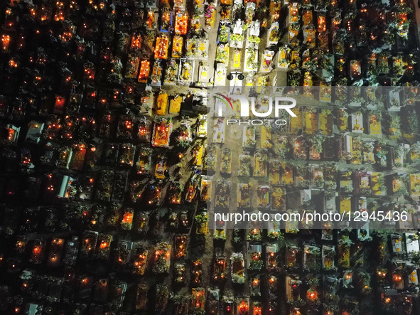 An aerial view of the San Andres Mixquic cemetery, located in Tlahuac, shows people accompanying their deceased loved ones in the traditiona... by Eyepix/NurPhoto