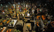 An aerial view of the San Andres Mixquic cemetery, located in Tlahuac, shows people accomp...