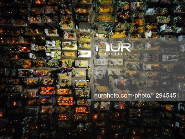 An aerial view of the San Andres Mixquic cemetery, located in Tlahuac, shows people accompanying their deceased loved ones in the traditiona... by Eyepix/NurPhoto