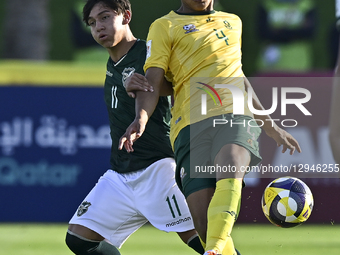 Marthinus Liam of South Africa and Garcia Santos of Bolivia are in action during the FIFA U-17 World Cup Qatar 2025 Group A match between So... by Noushad Thekkayil/NurPhoto