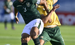 Hendricks Luke of South Africa and Mena Fernando of Bolivia are in action during the FIFA...