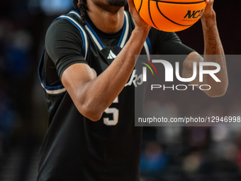 Jahki Gupton stands at the free throw line for the Saint Peter's Peacocks during an NCAA basketball game at Prudential Center in Newark, Uni... by Dan Squicciarini/NurPhoto