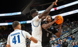 ZAAKIR WILLIAMSON (11) possesses the ball for the Saint Peter's Peacocks during an NCAA ba...
