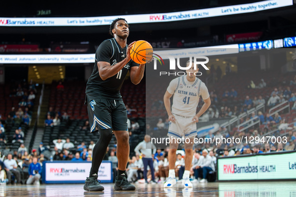 ZAAKIR WILLIAMSON (11) is at the free throw line for the Saint Peter's Peacocks during an NCAA basketball game at Prudential Center in Newar... by Dan Squicciarini/NurPhoto
