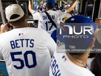 Dodgers fans ride the metro to the Dodgers World Championship Parade and Celebration in Los Angeles, CA, on November 3, 2025.  by J.W. Hendricks/NurPhoto