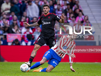 Jose Maria Gimenez of Atletico de Madrid receives a foul from Isaac Romero of Sevilla FC during the LaLiga EA Sports football match between... by Alberto Gardin/NurPhoto