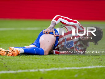 Jose Maria Gimenez of Atletico de Madrid is on the ground after receiving a foul during the LaLiga EA Sports football match between Atletico... by Alberto Gardin/NurPhoto