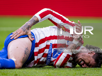 Jose Maria Gimenez of Atletico de Madrid is on the ground after receiving a foul during the LaLiga EA Sports football match between Atletico... by Alberto Gardin/NurPhoto