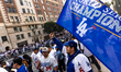 Dodgers fans wait for the Dodgers World Championship Parade and Celebration to start in Lo...