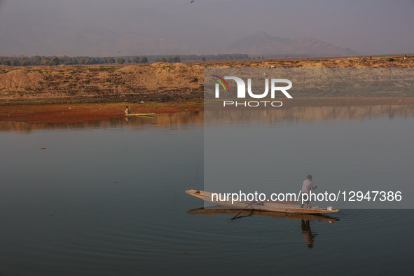 Fishermen catch fish in Wular Lake in Jammu and Kashmir, India, on November 1, 2025.  by Nasir Kachroo/NurPhoto