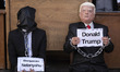 Two Iranian masked men impersonate U.S. President Donald Trump and Israeli Prime Minister...