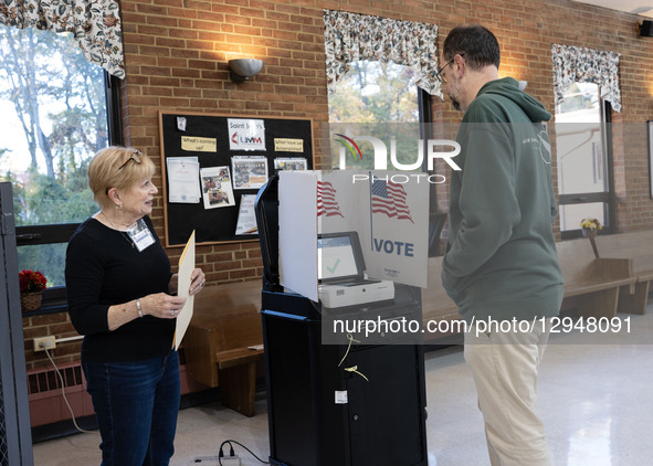 Voters cast their ballots at a polling station on Election Day morning in Fairfax, Virginia, on November 4, 2025. Virginians choose the comm... by Probal Rashid/NurPhoto